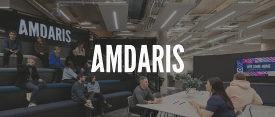 Amdaris office space featuring modern seating, collaborative areas, and vibrant digital signage with a welcoming message., Modern office design with Amdaris brand display and collaborative workspace for team interaction.