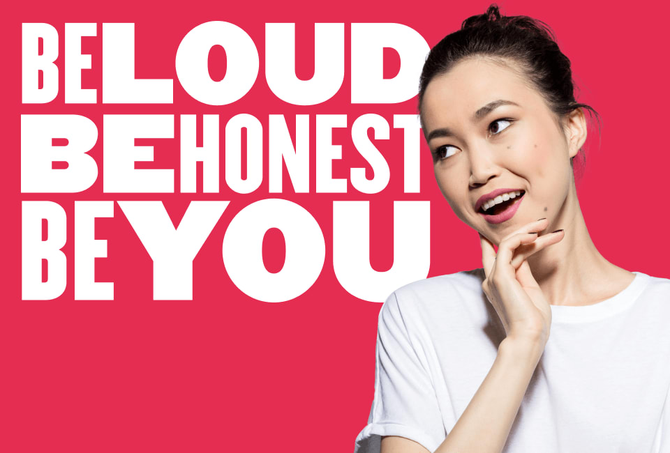 loud honest empowerment message with young woman in white shirt, bright pink background, confident female portrait encouraging self-expression