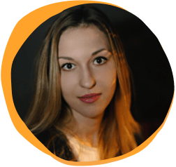 woman with long hair and expressive eyes in a soft-lit portrait, modern artistic photography with vibrant orange background