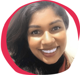 smiling woman with long dark hair and bright white teeth, circular crop with pink background highlights her face