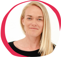 portrait of a woman with blonde hair smiling against a light background, professional headshot with a vibrant pink border