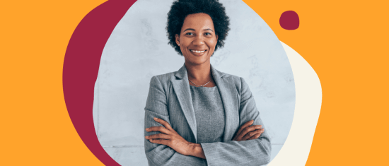 businesswoman in a gray suit posing confidently with crossed arms in front of a colorful abstract background, confident professional woman smiling in a modern office setting
