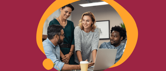 collaborative team meeting, diverse professionals working on a laptop in a modern office setting
